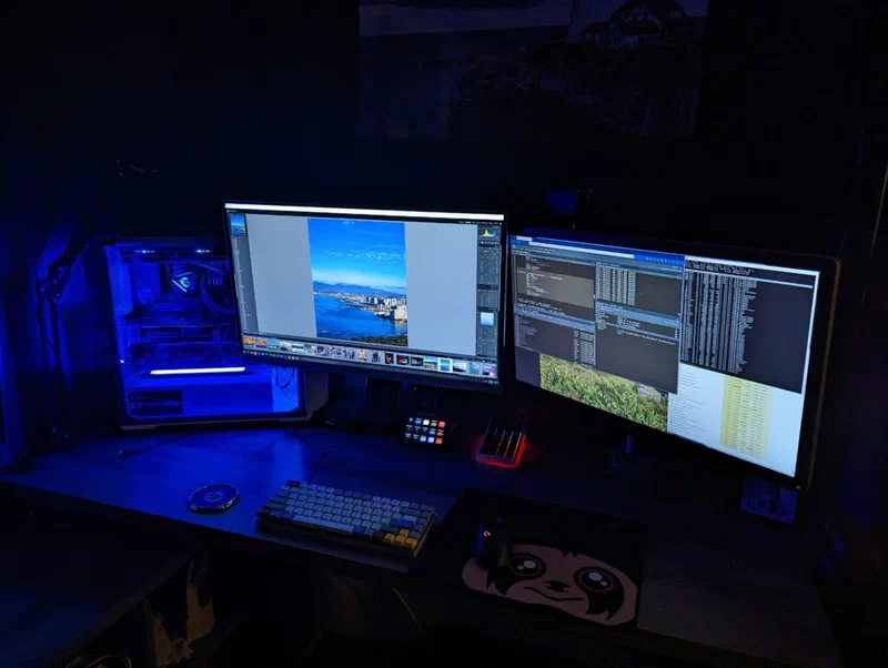 A dual-monitor setup displays a photo editing software in a dark room. The setup includes a computer tower with RGB lighting and various peripherals, demonstrating the technical infrastructure supporting this data analysis.